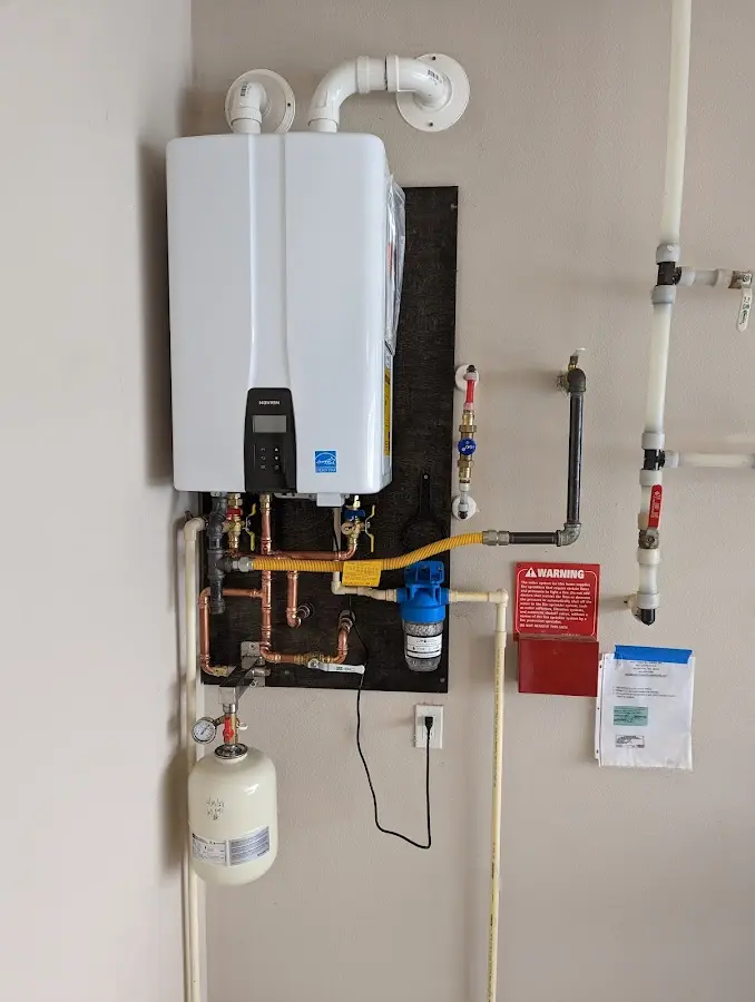 Professional plumber installing copper piping in a Humboldt Hill home